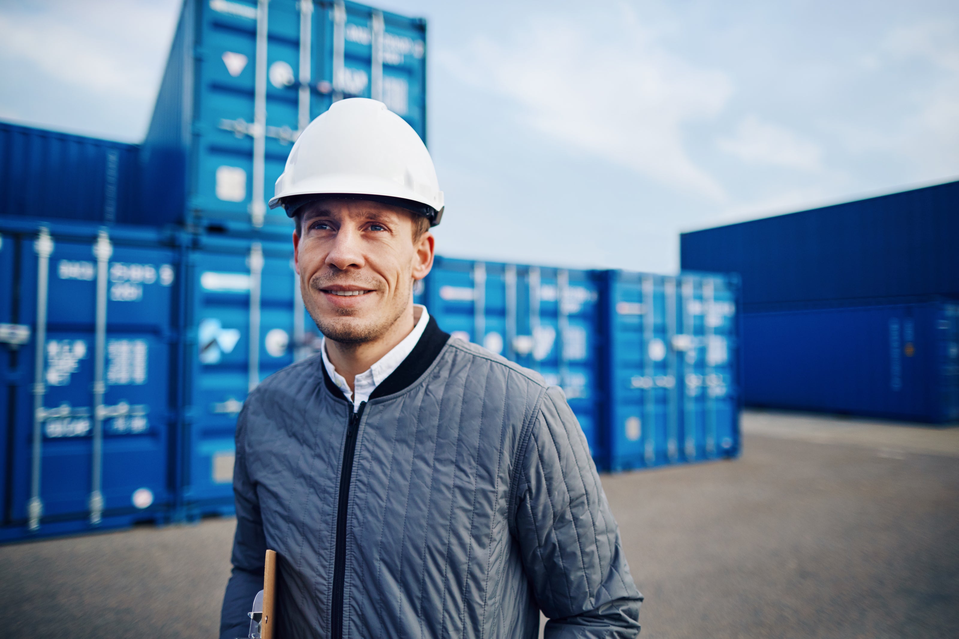 a man working on ports with the using blockchain system 
