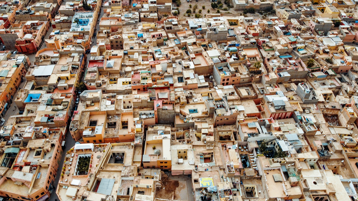 Aerial view of a densely packed urban area with numerous buildings.